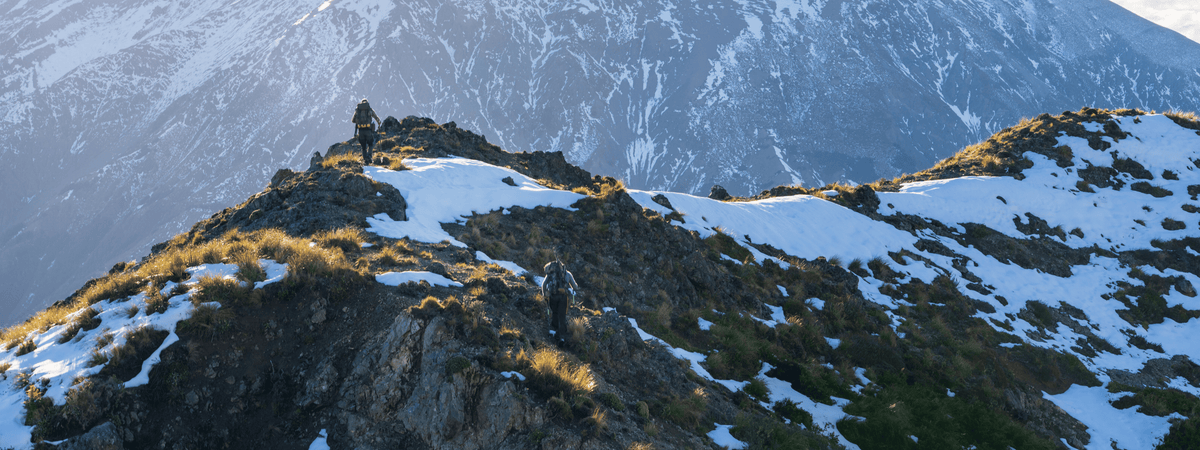 man hiking new zealand mountains