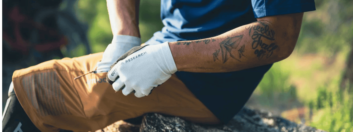 Outdoor research gloves worn by man hiking