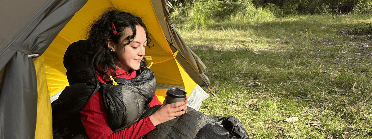 Girl using sea to summit sleeping bag camping in australia
