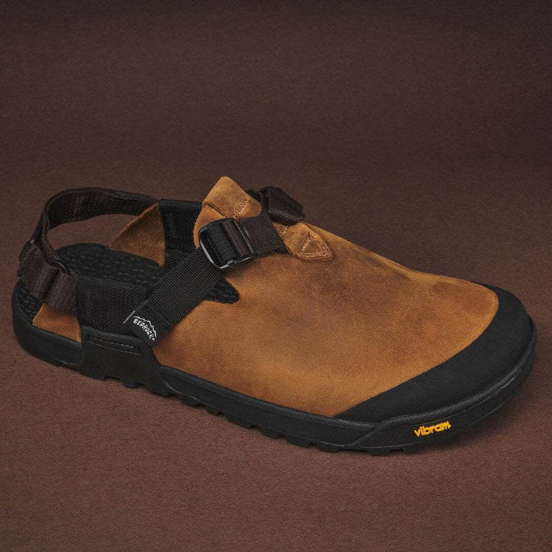The bedrock sandals mountain clog in nubuck leather brown shown on a brown background