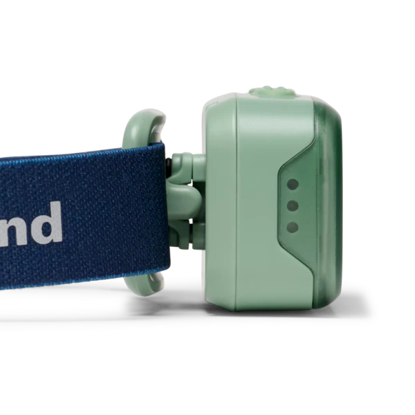 Green pet collar device attached to a blue strap on a white background