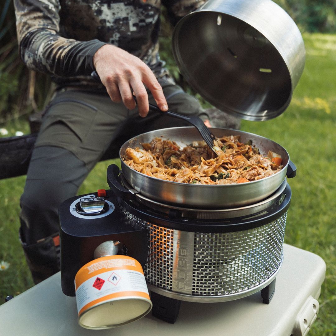 Cobb Grill cooking while camping