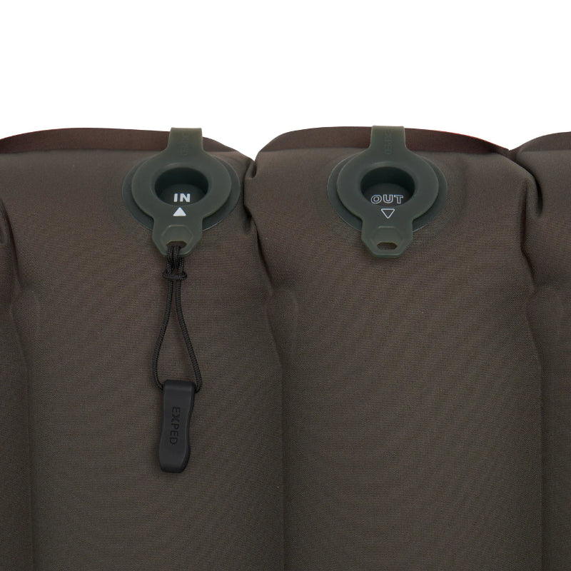 Close-up of a brown inflatable mattress with air valve controls on a white background