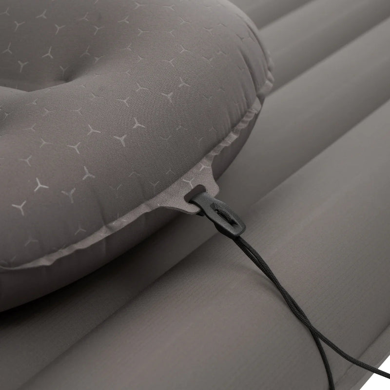 Gray inflatable mattress with a zipper and handle on a gray background