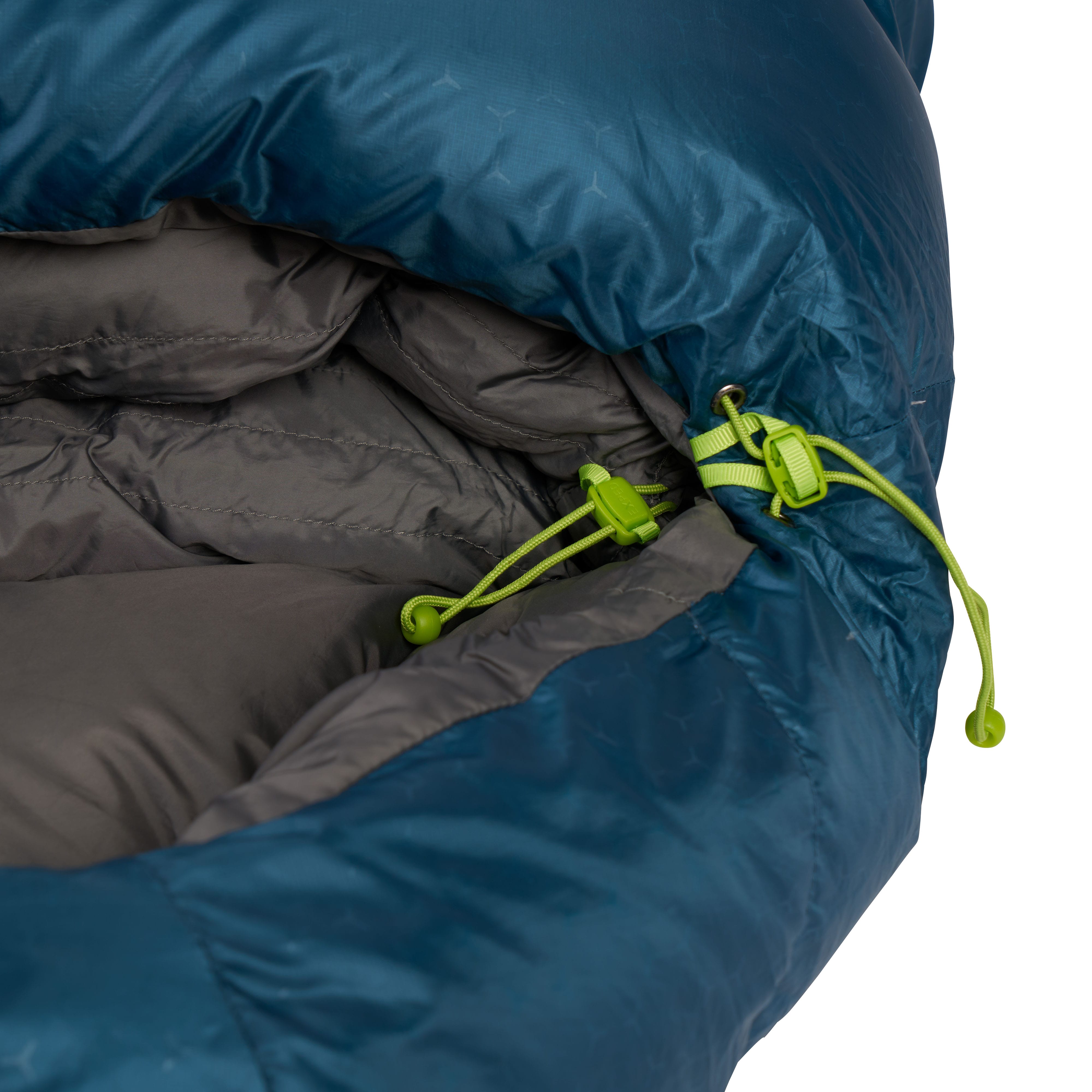 Close-up of a blue and gray sleeping bag hiking with green drawstrings.