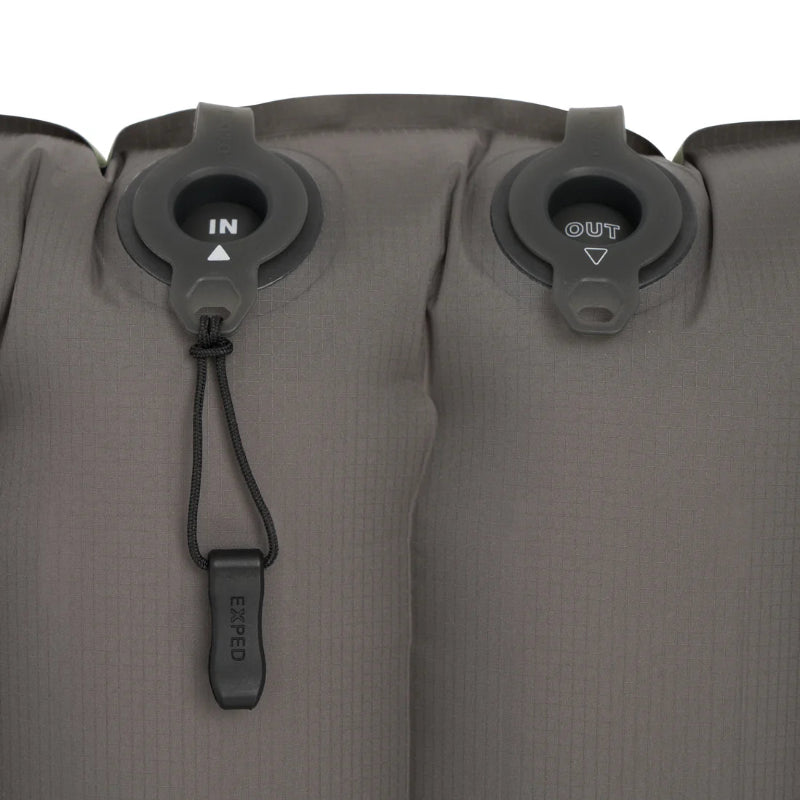 Close-up of a gray inflatable mattress with valve controls on a white background