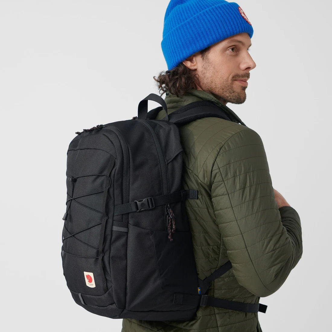 Man wearing a black fjallraven backpack