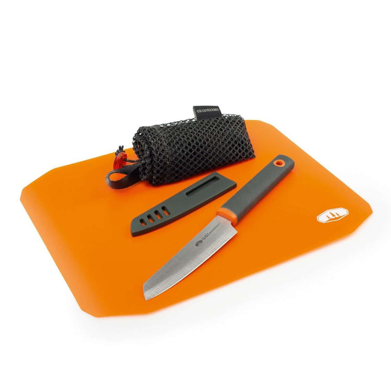 A rollup cutting board knife set with an orange cutting board, a silver knife, and a black protective sheath.
