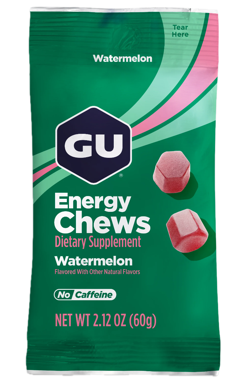 Green package of GU Energy Chews Watermelon flavor with red chewable tablets on a white background