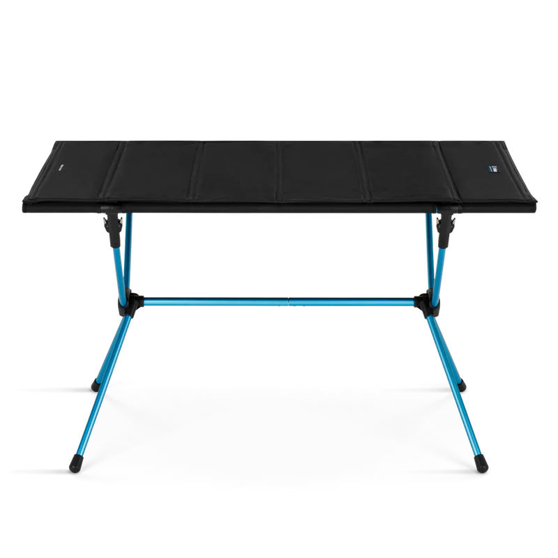Black folding table with blue legs on a white background