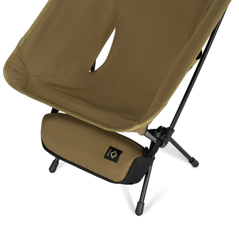 Brown camping chair with black legs on a white background