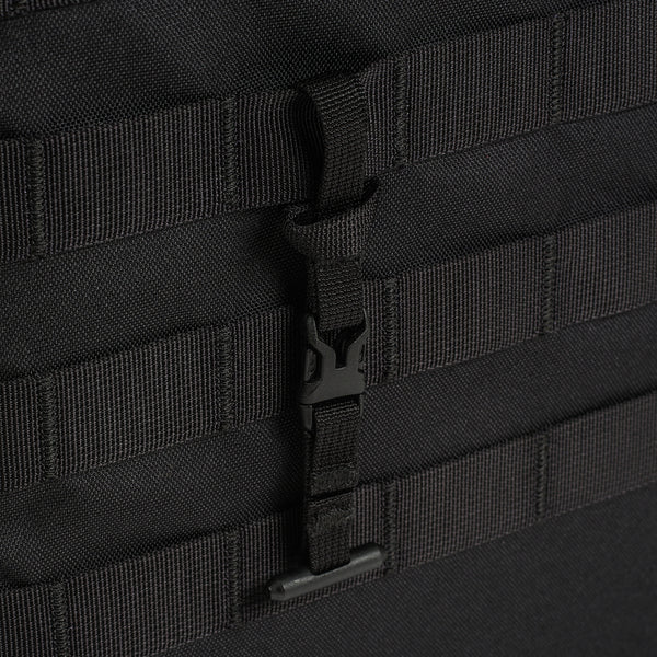 Close-up of a black helinox tactial molle table with straps