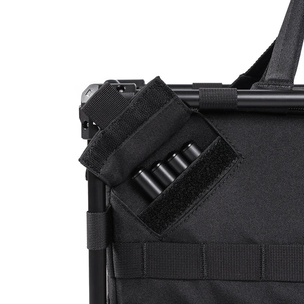 Black tactical bag with multiple straps and compartments on a white background