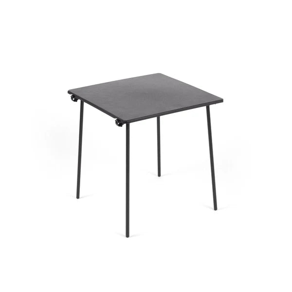Black square table with metal legs on a white background