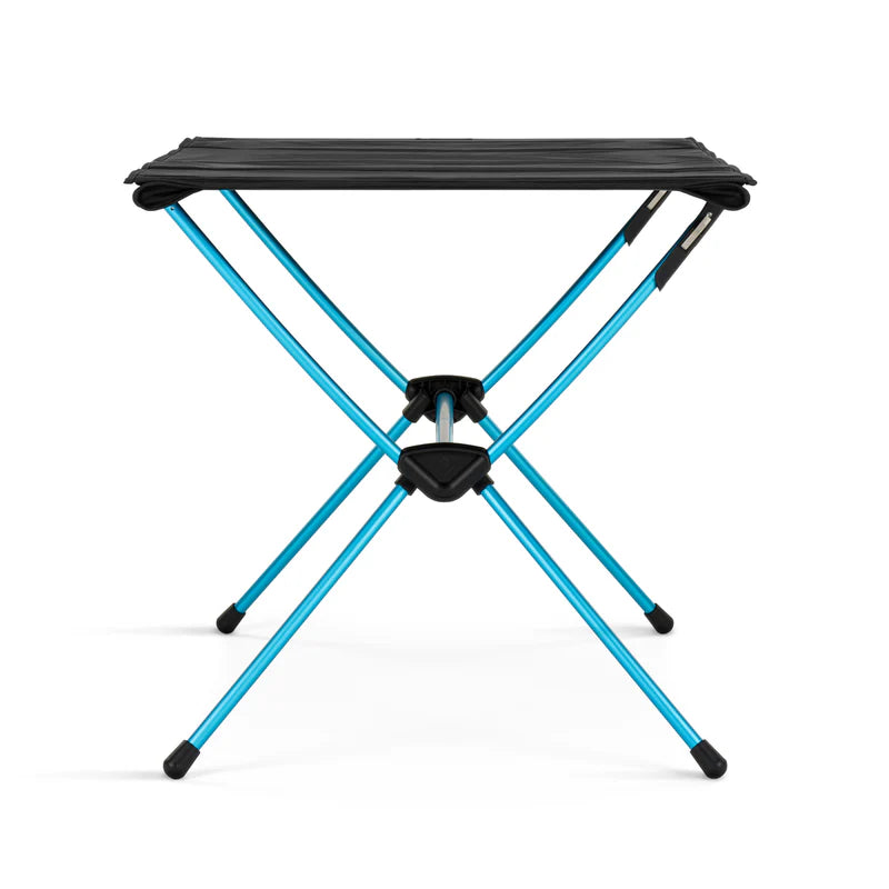 Portable camping table with blue legs and black top on a white background