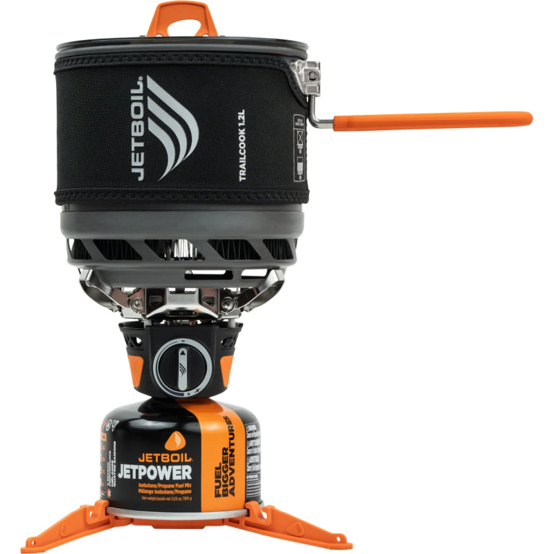 Jetboil cooking system with black pot and orange accents on a white background