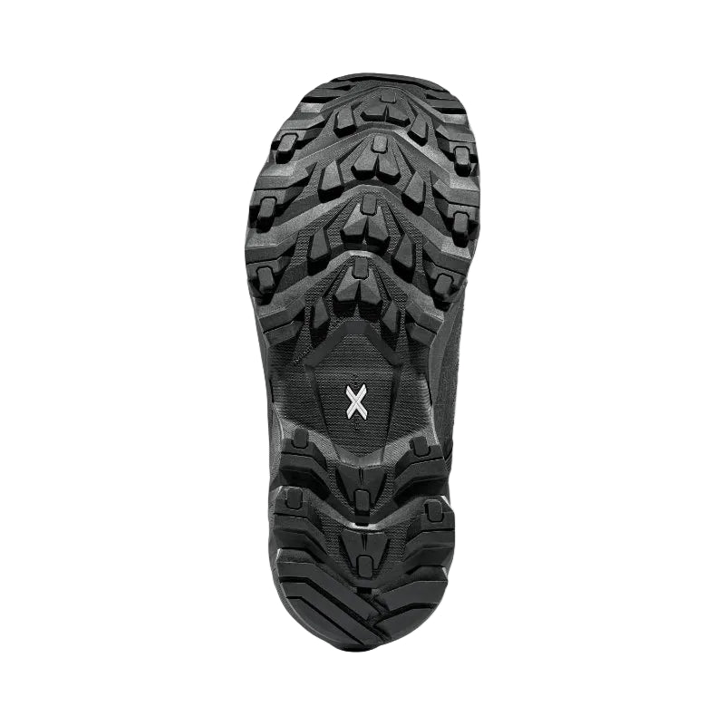 Close-up of a black hiking boot sole with a brand logo on a light gray background