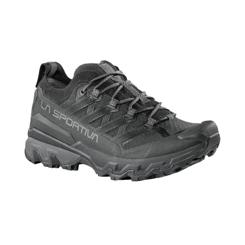 Gray hiking shoe with brand logo on a light gray background