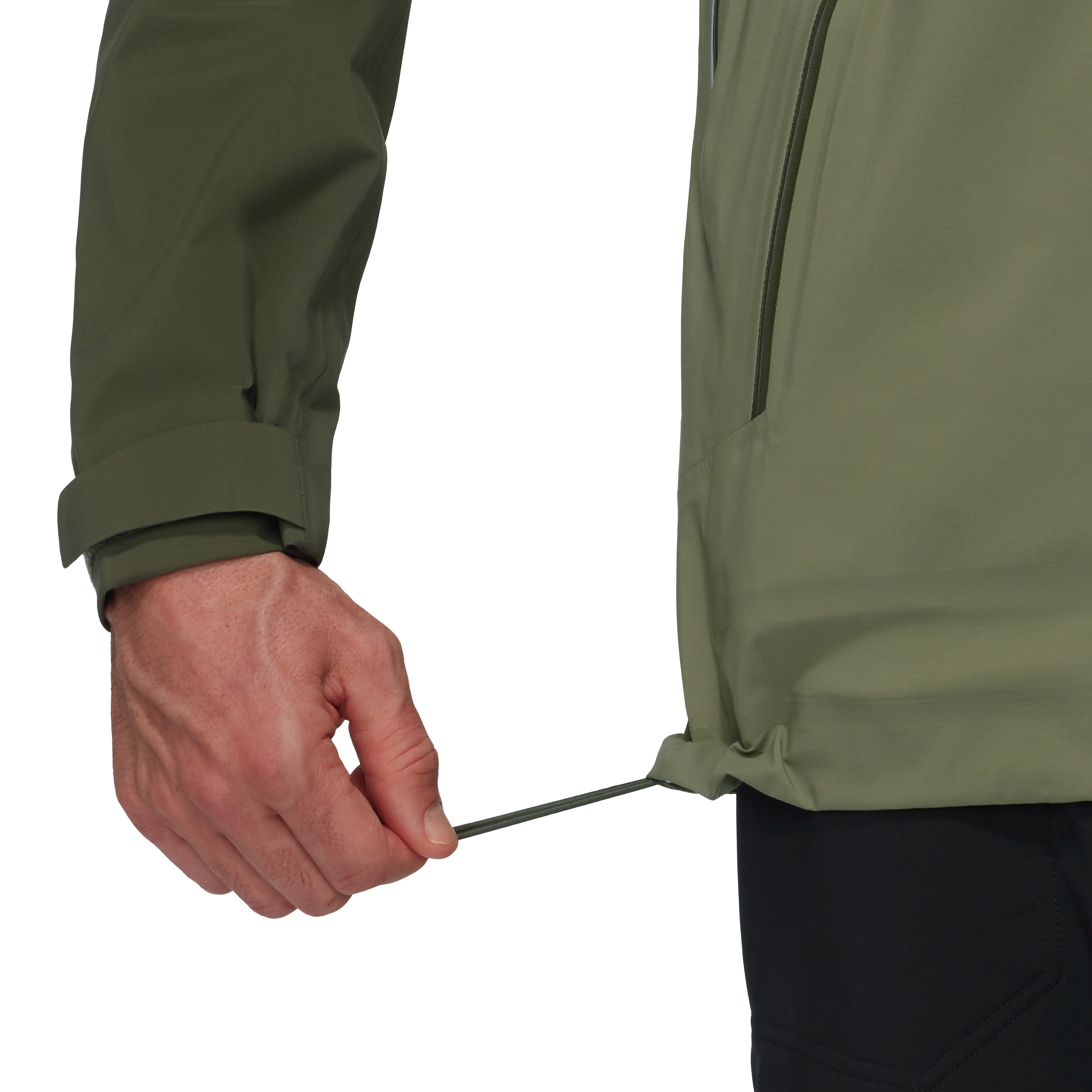 Person adjusting the drawstring of a green jacket on a white background