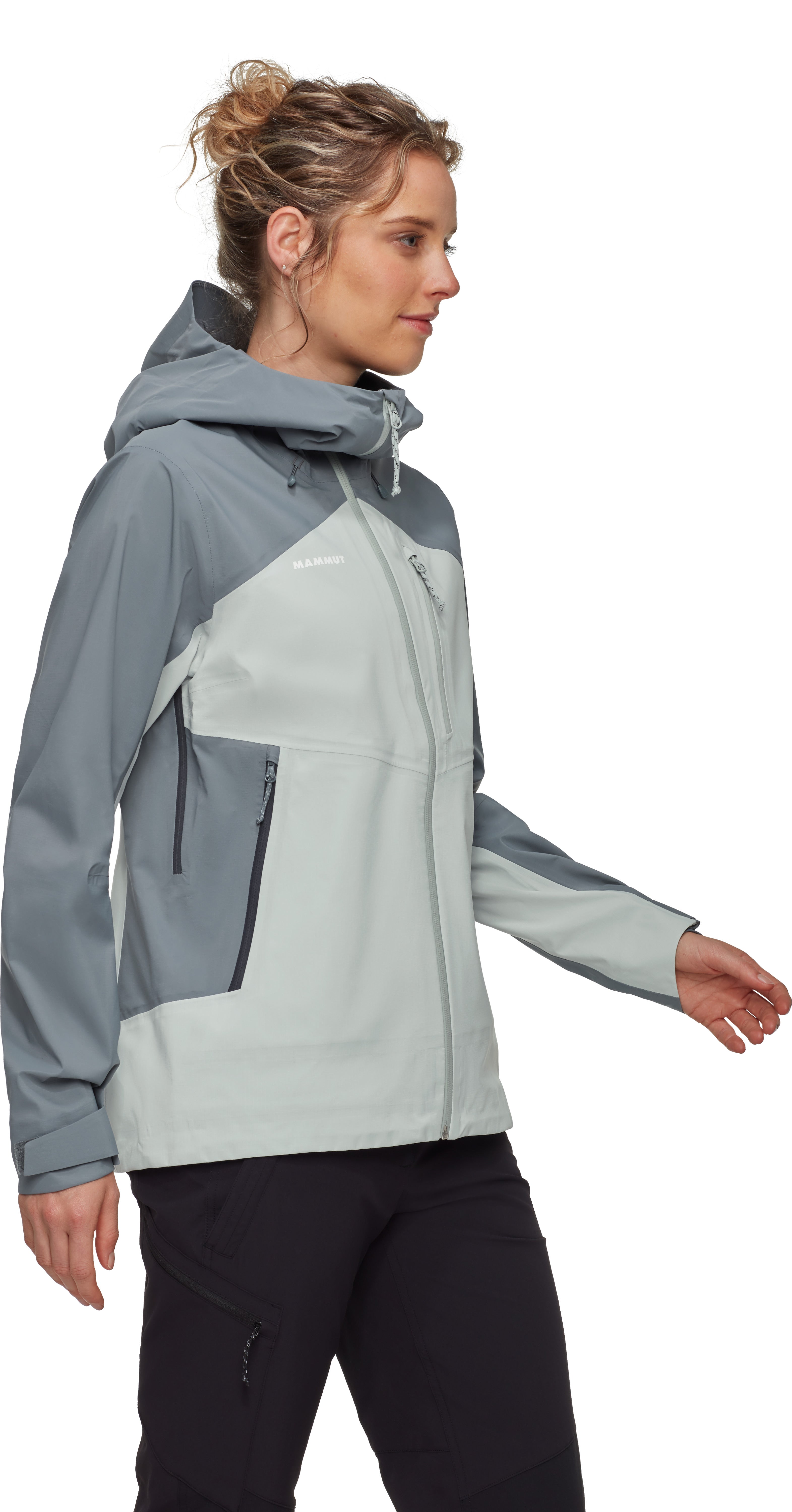 Woman wearing a gray and black jacket on a white background