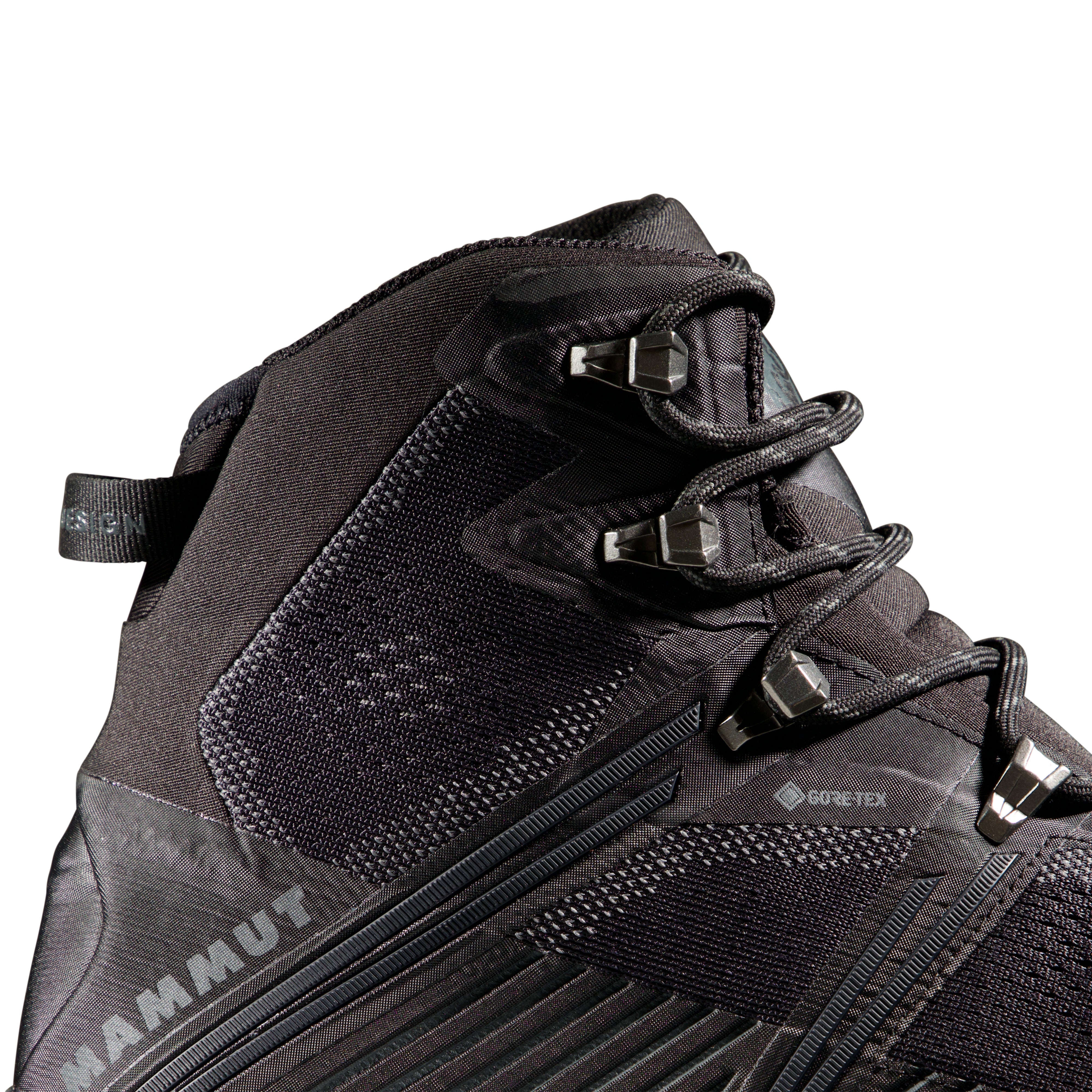 Black hiking boot with visible Mammut branding on a white background