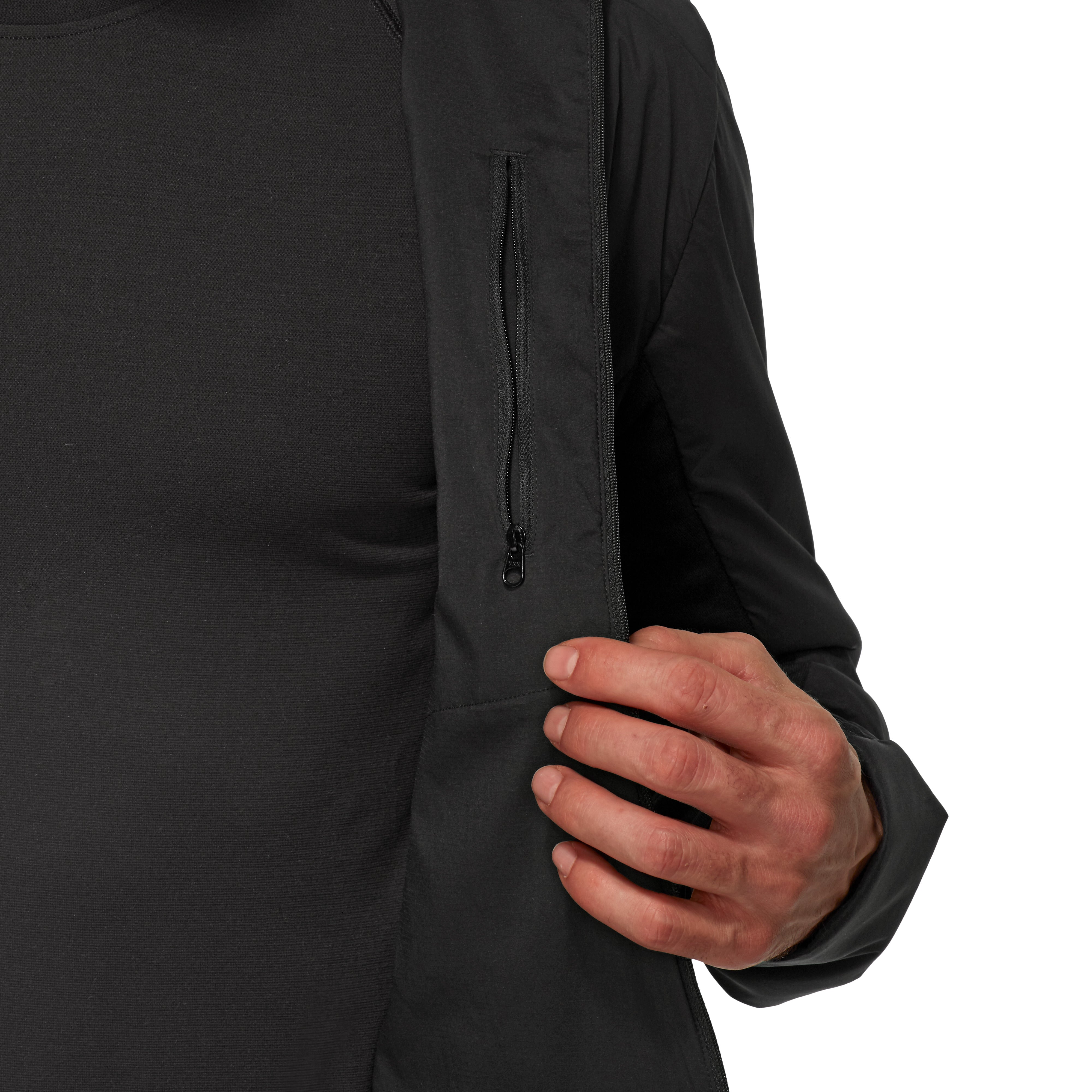 Close-up of a person wearing a black long-sleeve shirt with a zipper on a white background