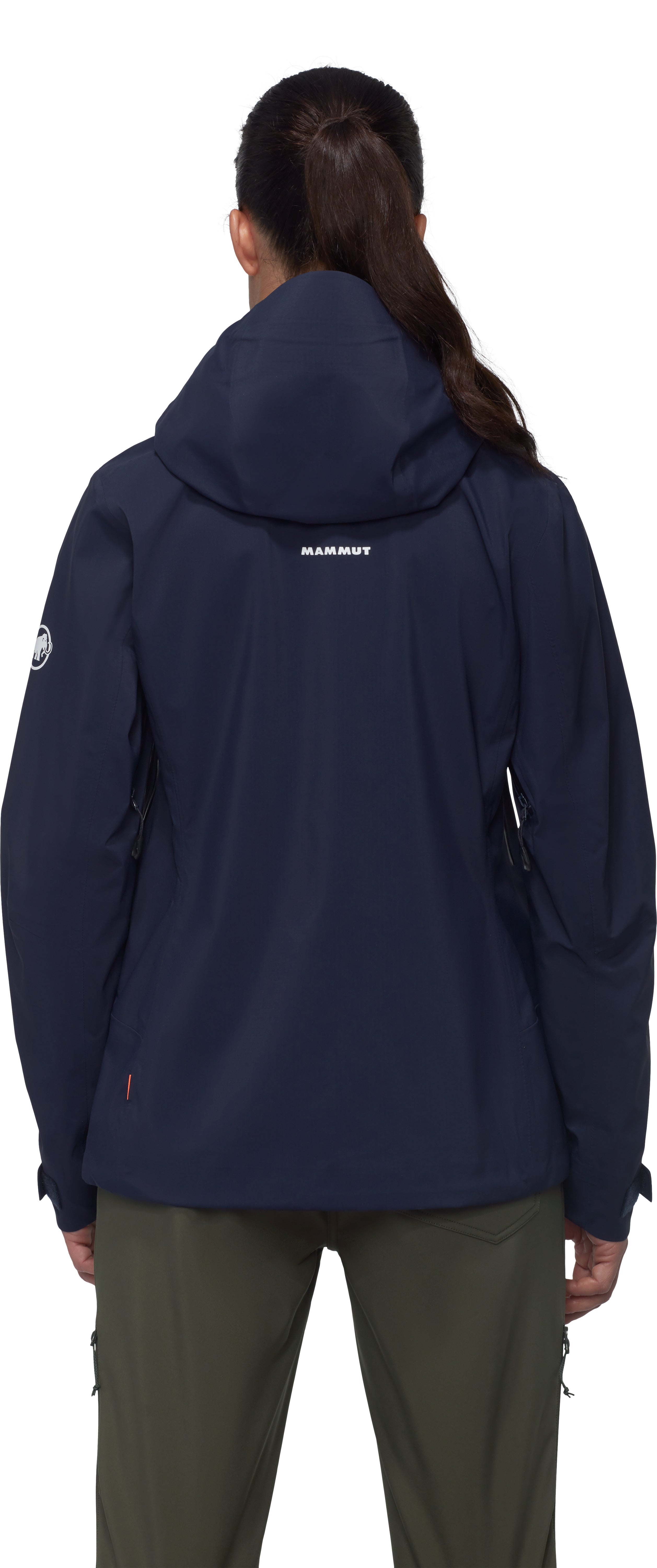 Person wearing a navy blue jacket with a visible brand logo on a white background