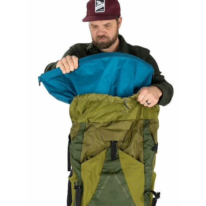 Man using Osprey Hiking Pack Liner in his bag