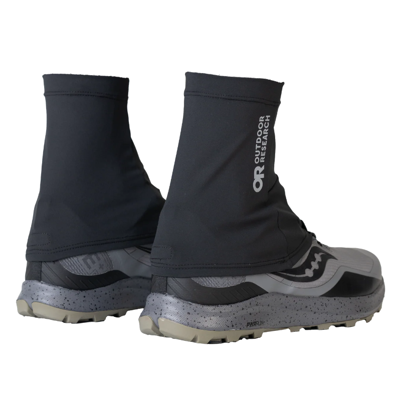 Black gaiters with 'Outdoor Research' branding on a white background