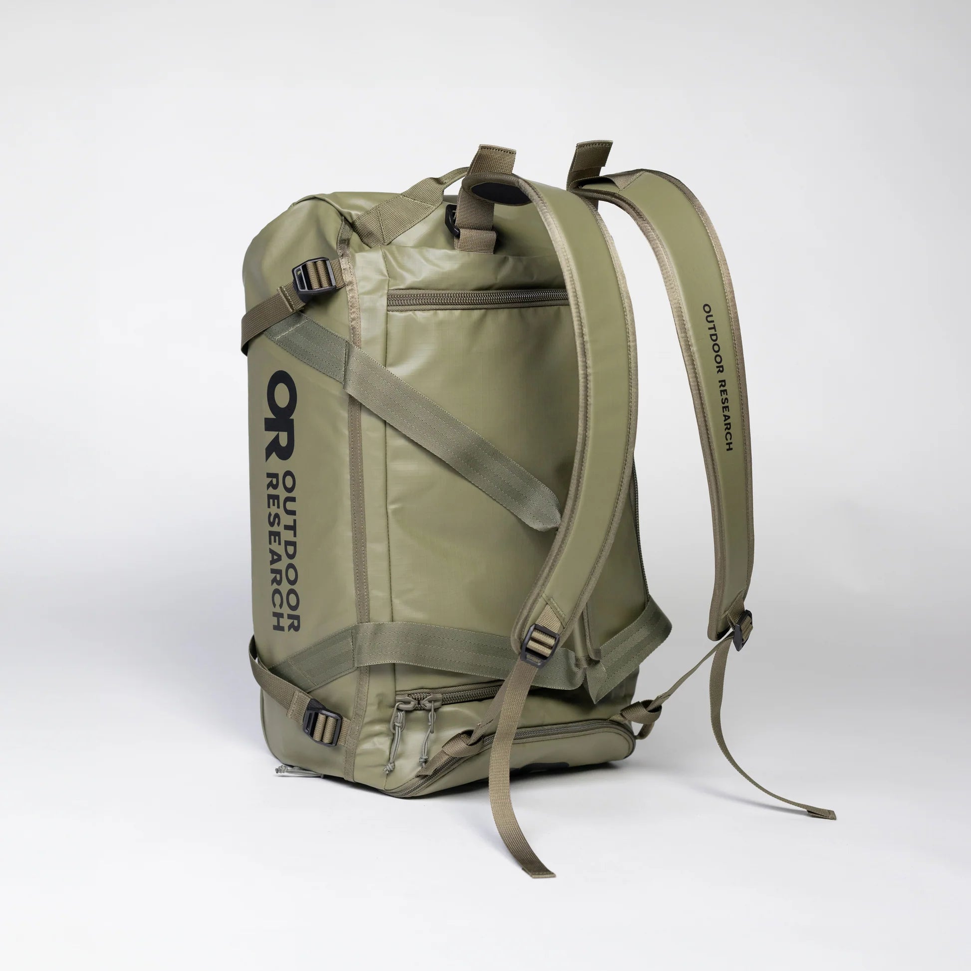 Green backpack with 'Outdoor Research' branding on a white background