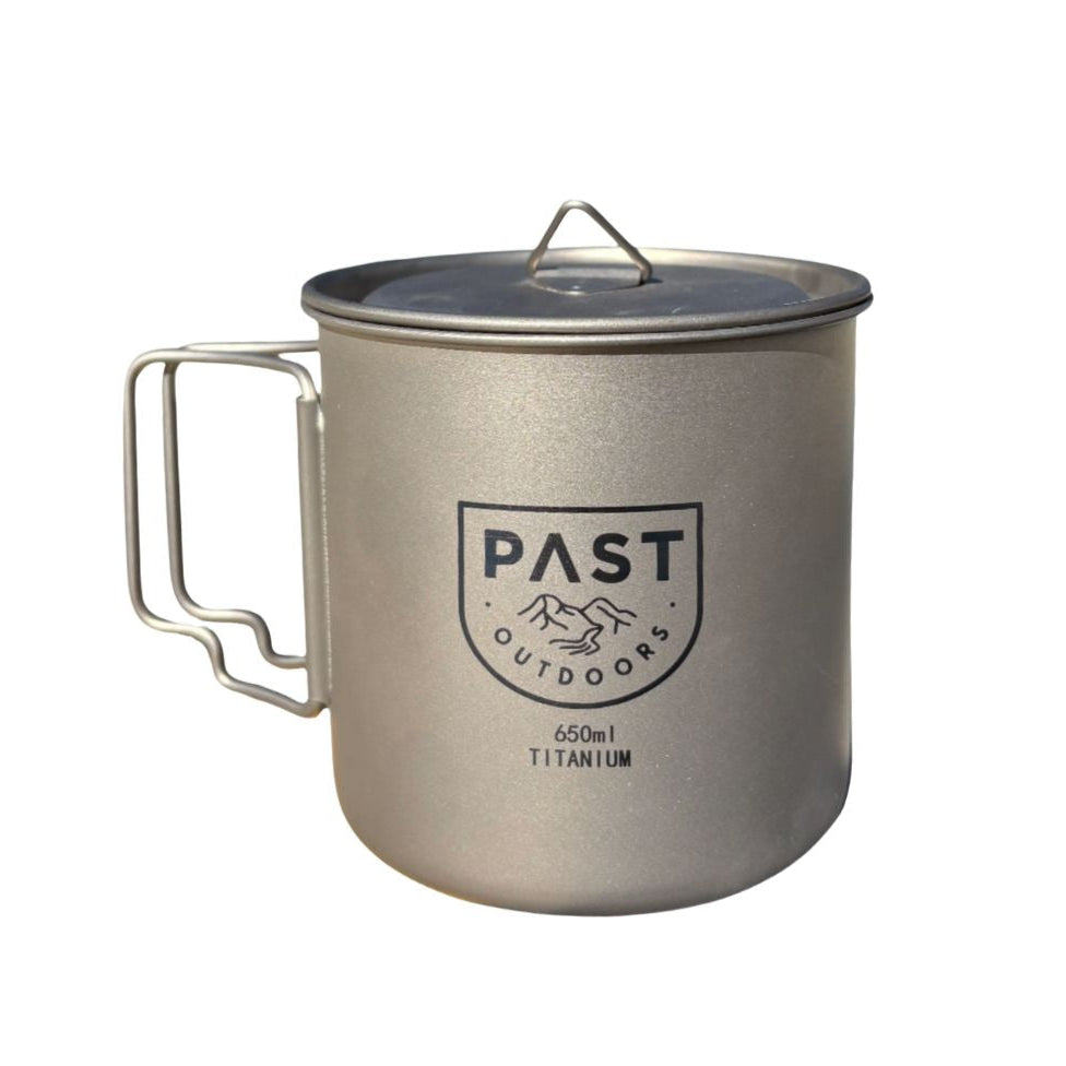 Titanium mug with handle and lid on a white background, featuring 'PAST Outdoors' branding.