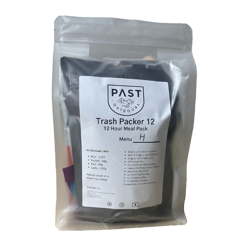 Packaged meal with 'PAST Outdoors' label on a wooden surface