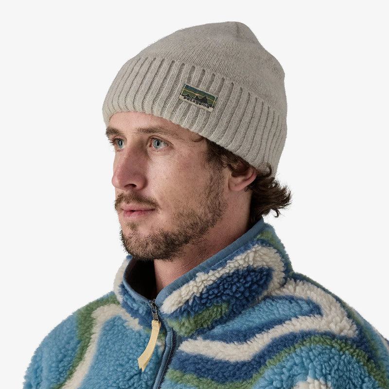 Patagonia Brodeo Beanie Crisp Grey Worn by a man in a blue jacket