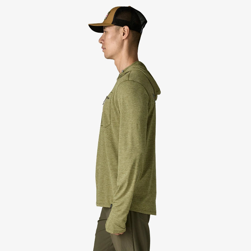 Man standing to the side with a trucker hat wearing the Patagonia Men’s Capilene Cool Sun Hoody Fitz Roy Trout