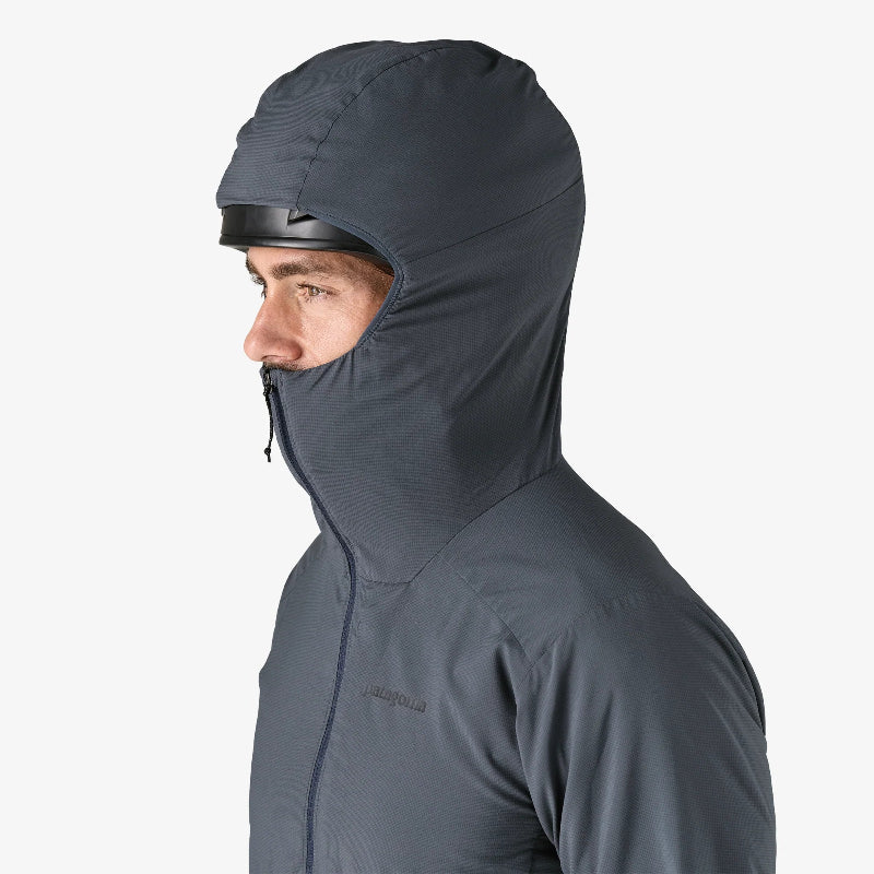 Patagonia Men's Nano-Air® Ultralight Full-Zip Hoody worn by a man, zipped up covering his helmet