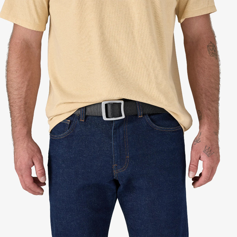 Man wearing blue jeans and Patagonia Tech Web Belt Forge Grey