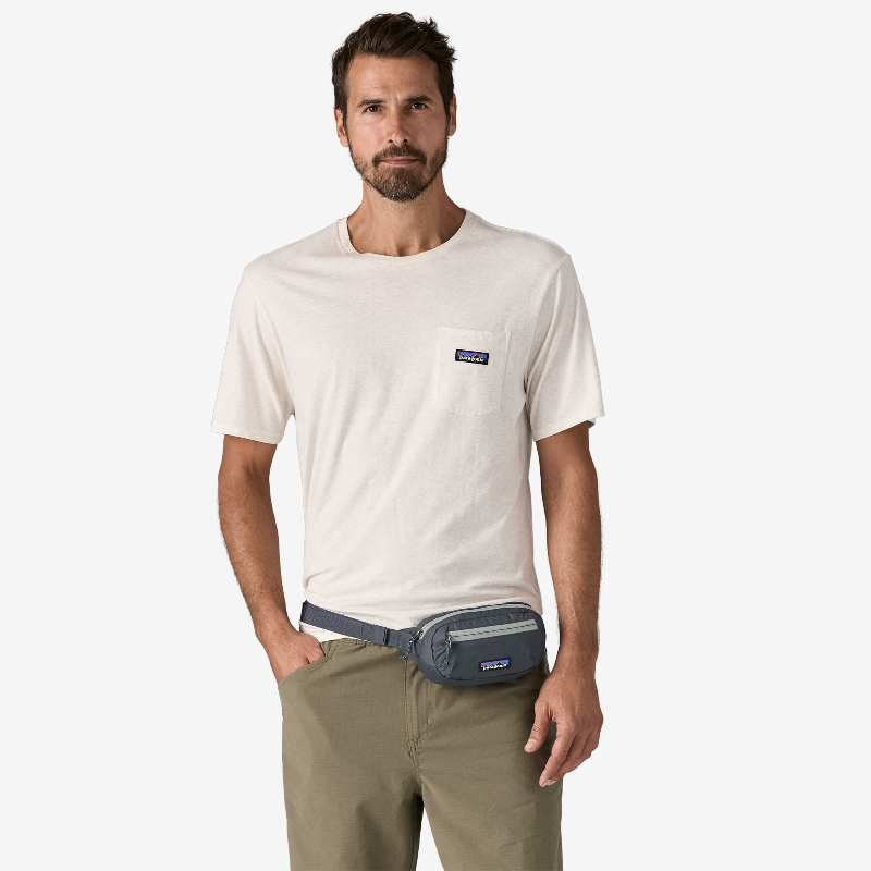 Man wearing the Patagonia Terravia Mini Hip Pack 1L as a hip pack