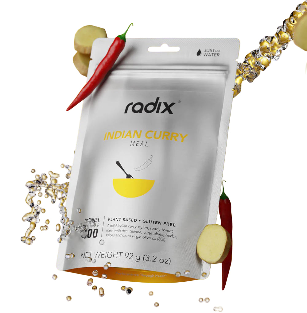 Radix Indian Curry meal package on a yellow background with spices and a chili pepper.