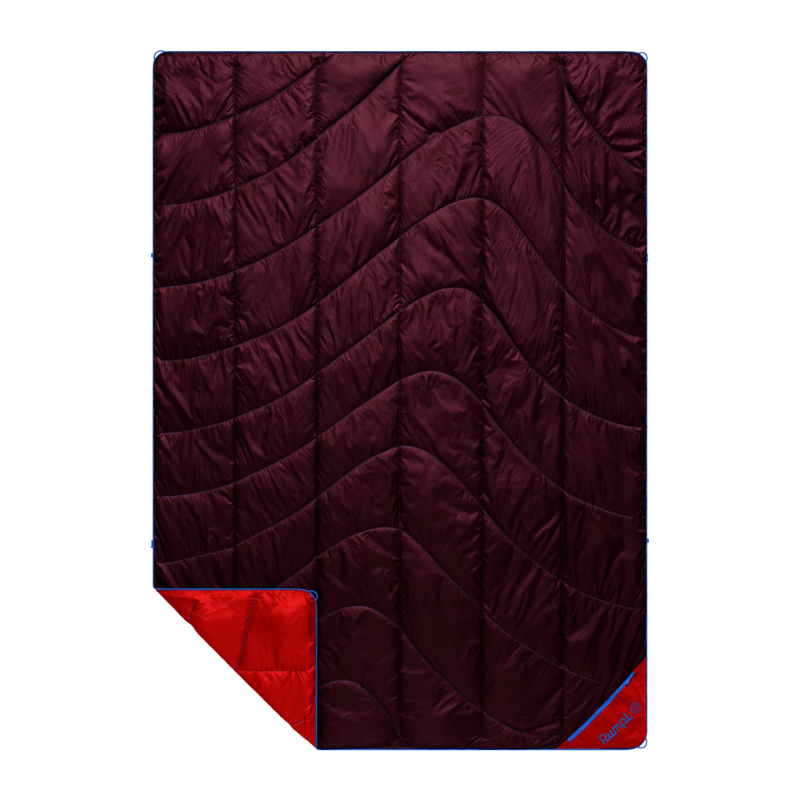 A dark burgundy quilted sleeping pad with a bright red reverse side and blue trim, shown on a plain white background.