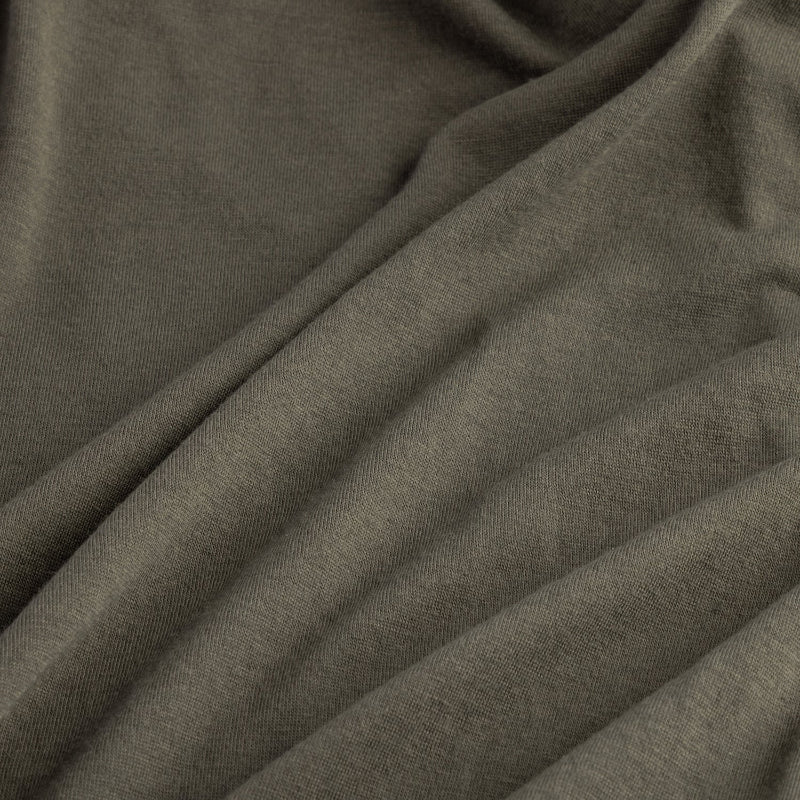 Close-up of dark gray fabric with folds