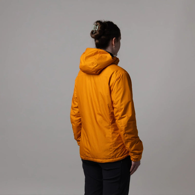 Person wearing a bright orange jacket against a plain background