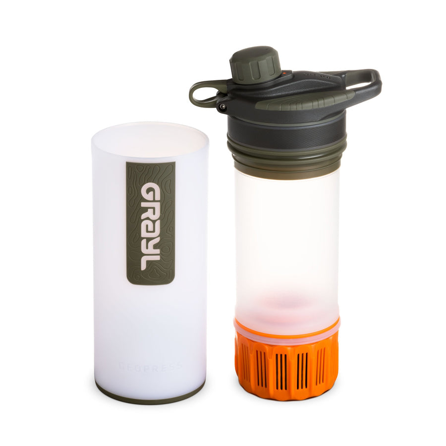 Grayl water filtration bottle with white base and orange accent on a white background