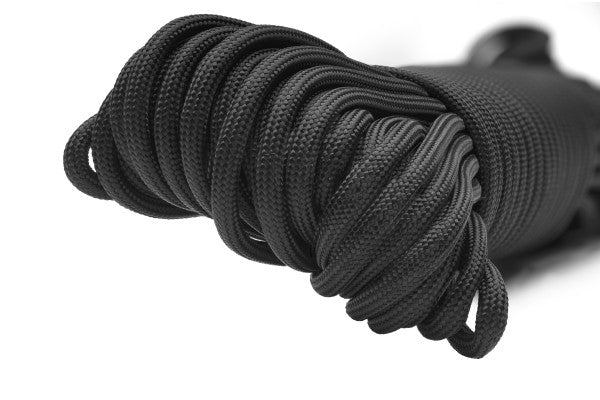Coiled black rope on a white background