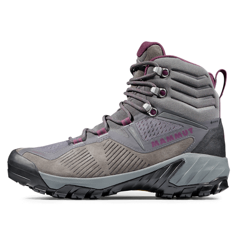 A pair of Mammut Sapuen High GTX Womens Hiking Boots in colors Dark Titanium and Light Grape, featuring a knitted sock construction and a Vibram sole for outdoor traction.