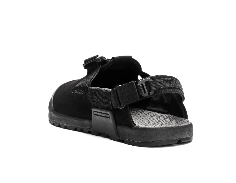 Black sandal with velcro straps on a white background