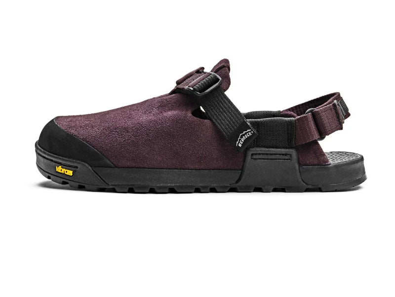 Purple sandal with black sole on a white background