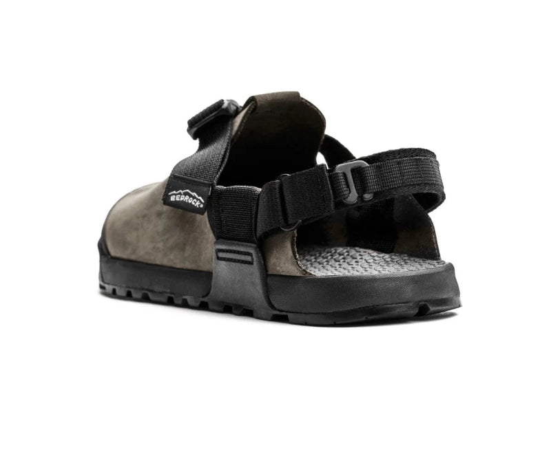 Black sandal with a strap on a white background