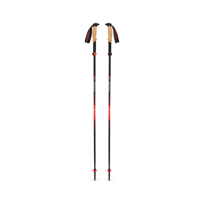 Black hiking poles on a white background