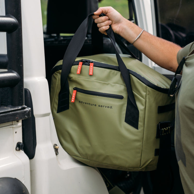 COBB Anywhere Bag being put into a car
