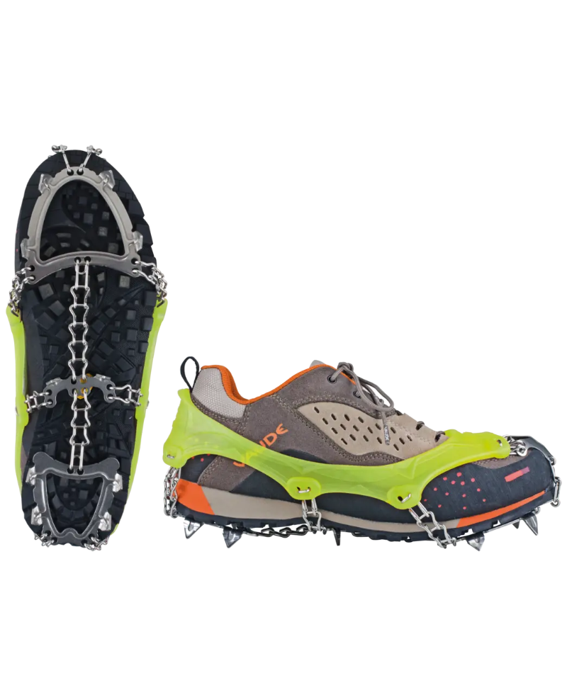 Green and gray shoe with cleats on a white background